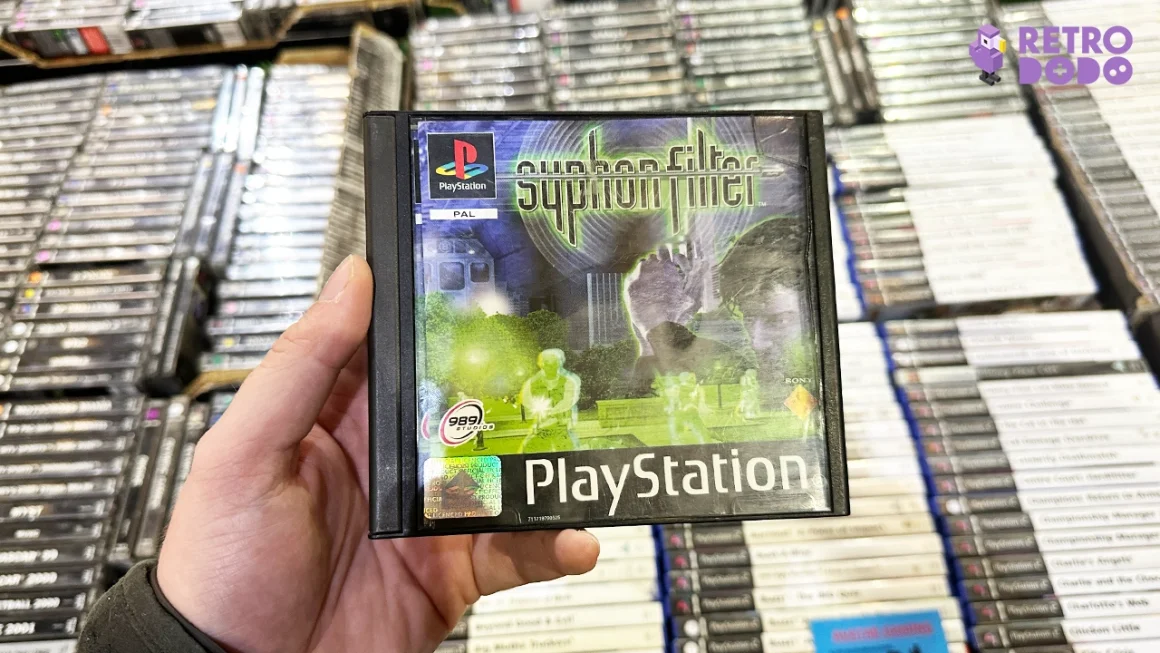 syphon filter ps1 game case in Theo's hand