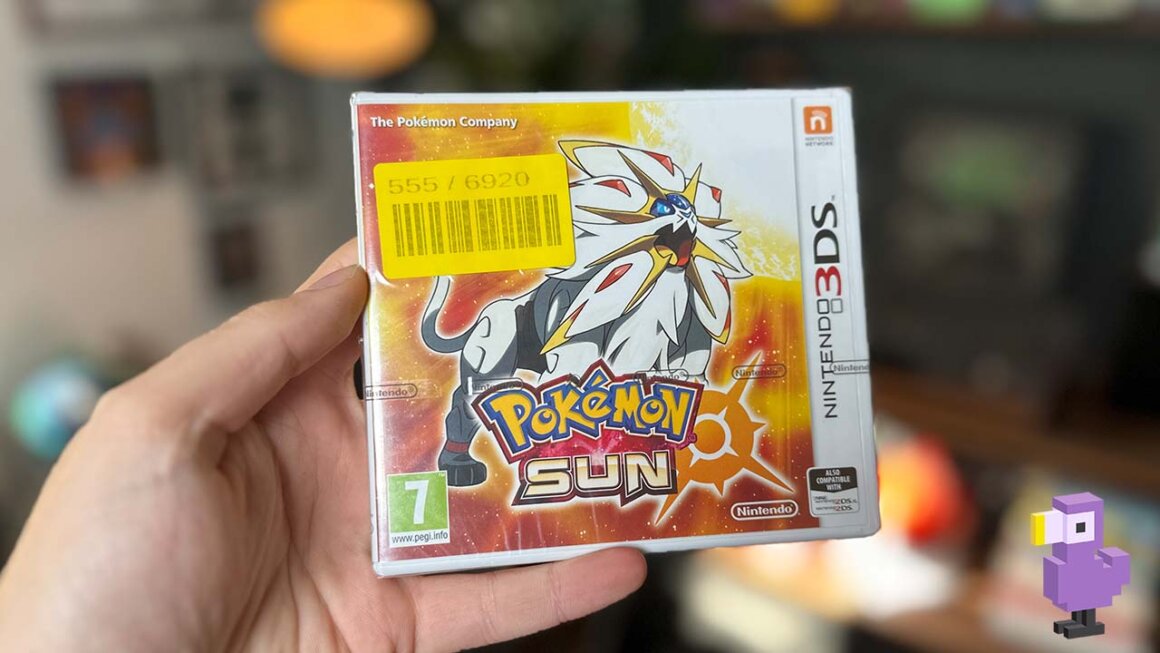 Pokemon Sun game case held by Brandon