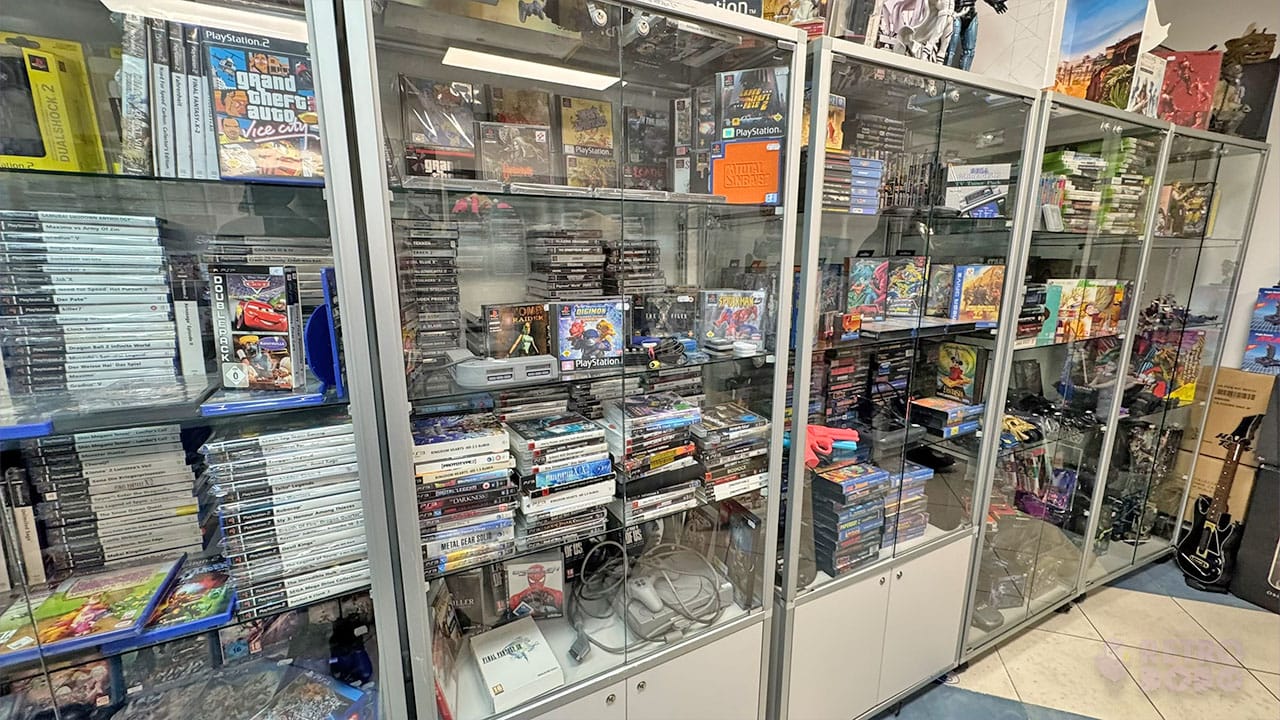 A cabinet filled with Playstation games and accessories