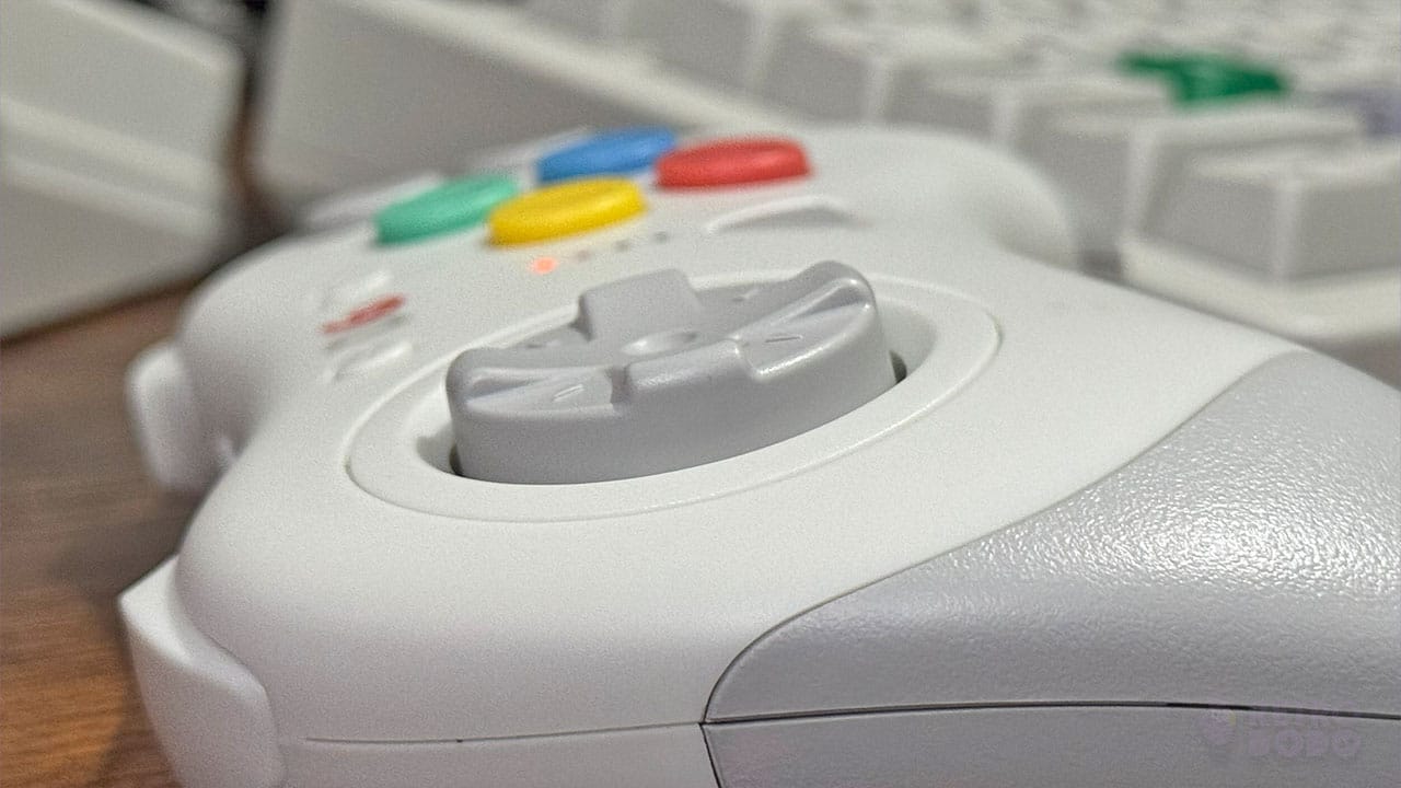 A close up of the D-pad on the D6 controller