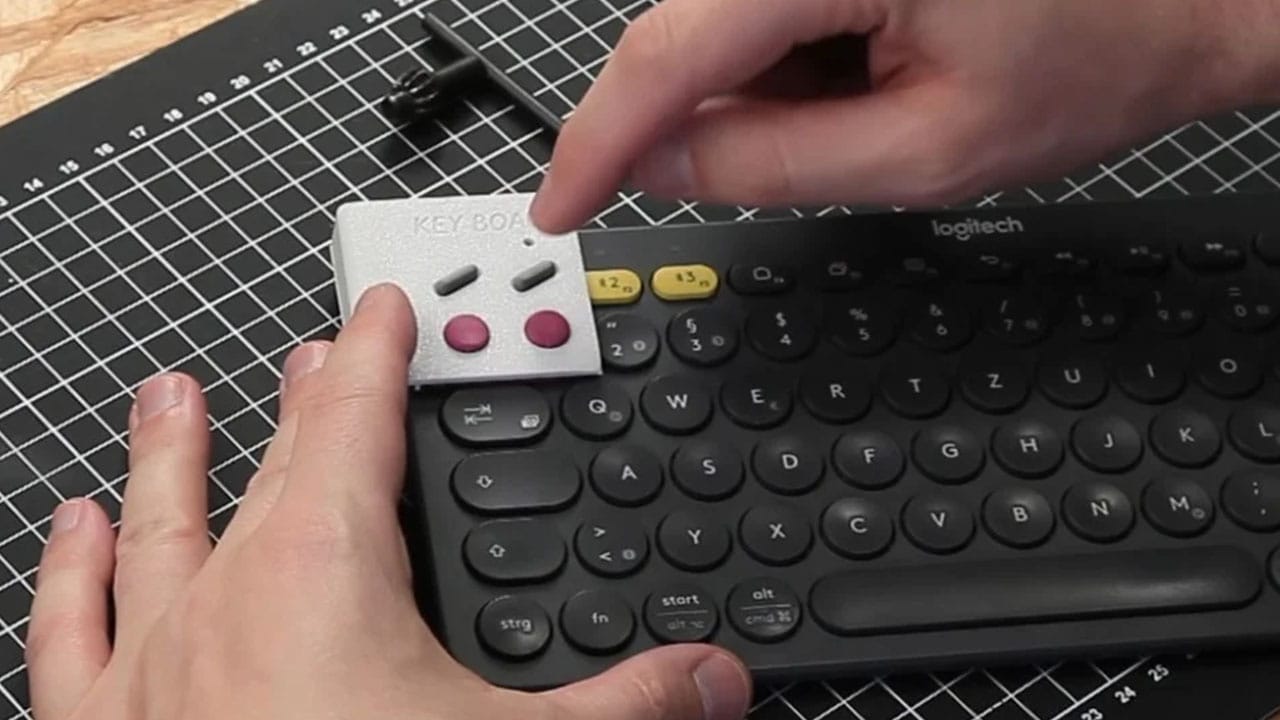 Making the Key Boy by glueing pieces onto a Logitech keyboard