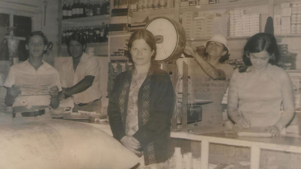 A black and white photo of the original team inside the store