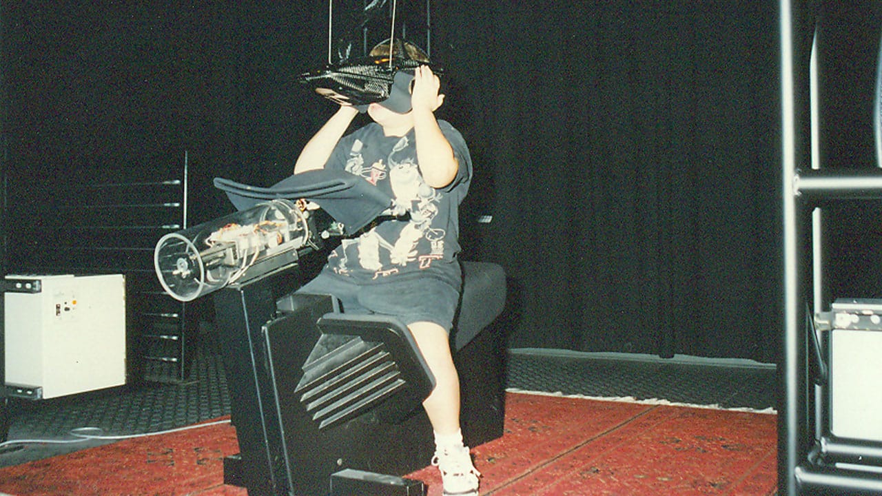 Mike as a child with an early VR exhibit at Disney World.