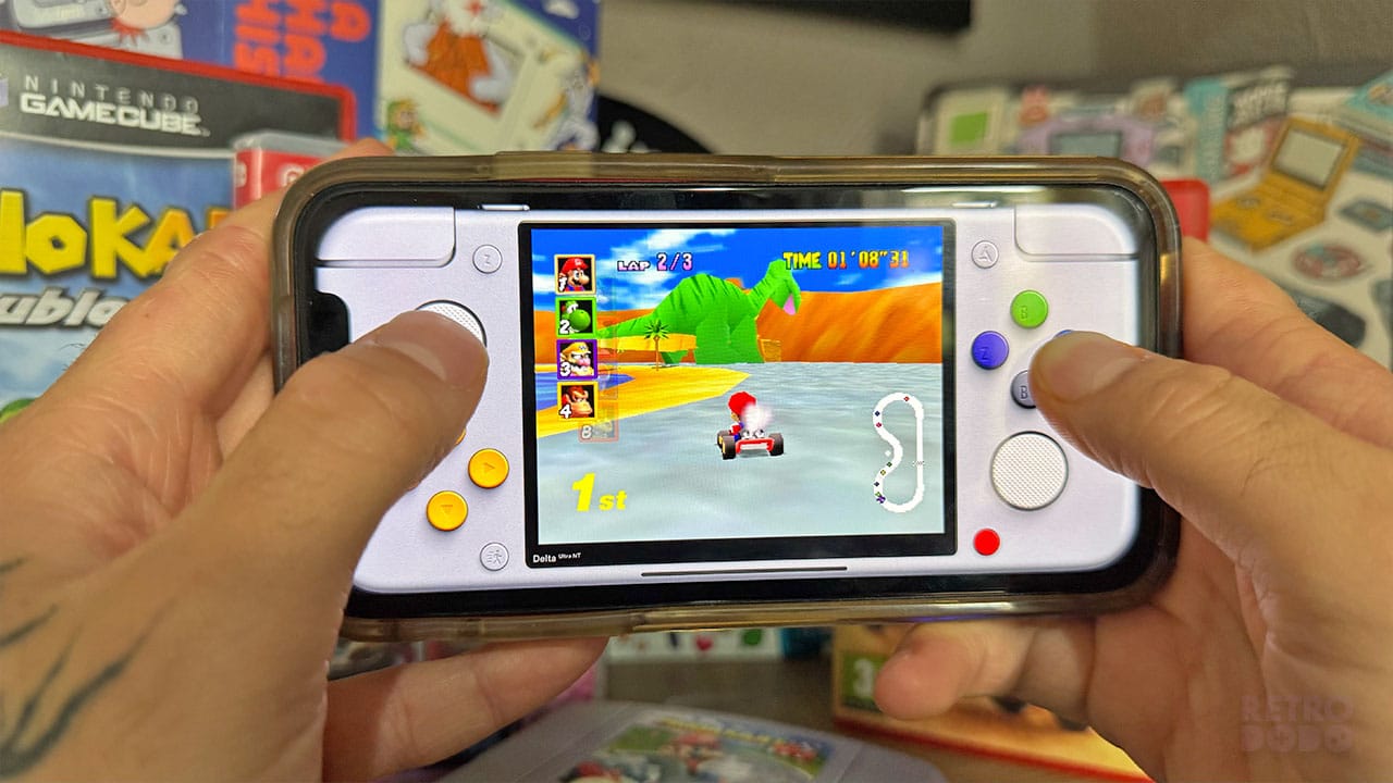 Seb holding his phone with Mario on screen