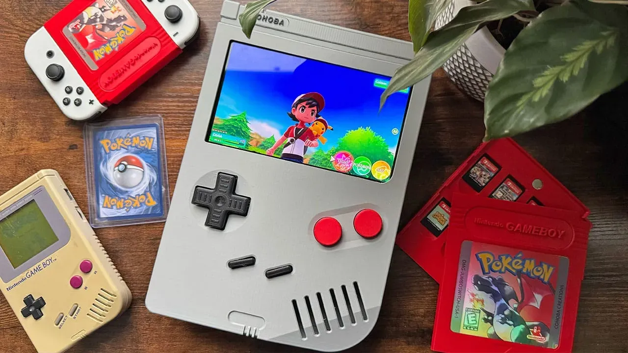 A Jumbo Game Boy Dock with Pokémon on the screen. There is also a jumbo version of Pokémon Red with Switch games stored inside it