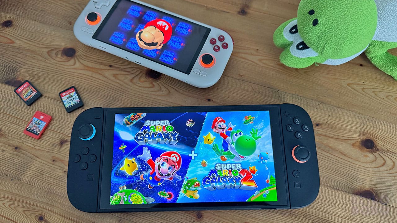 Super Mario Galaxy 1+2 next to a soft toy of Yoshi