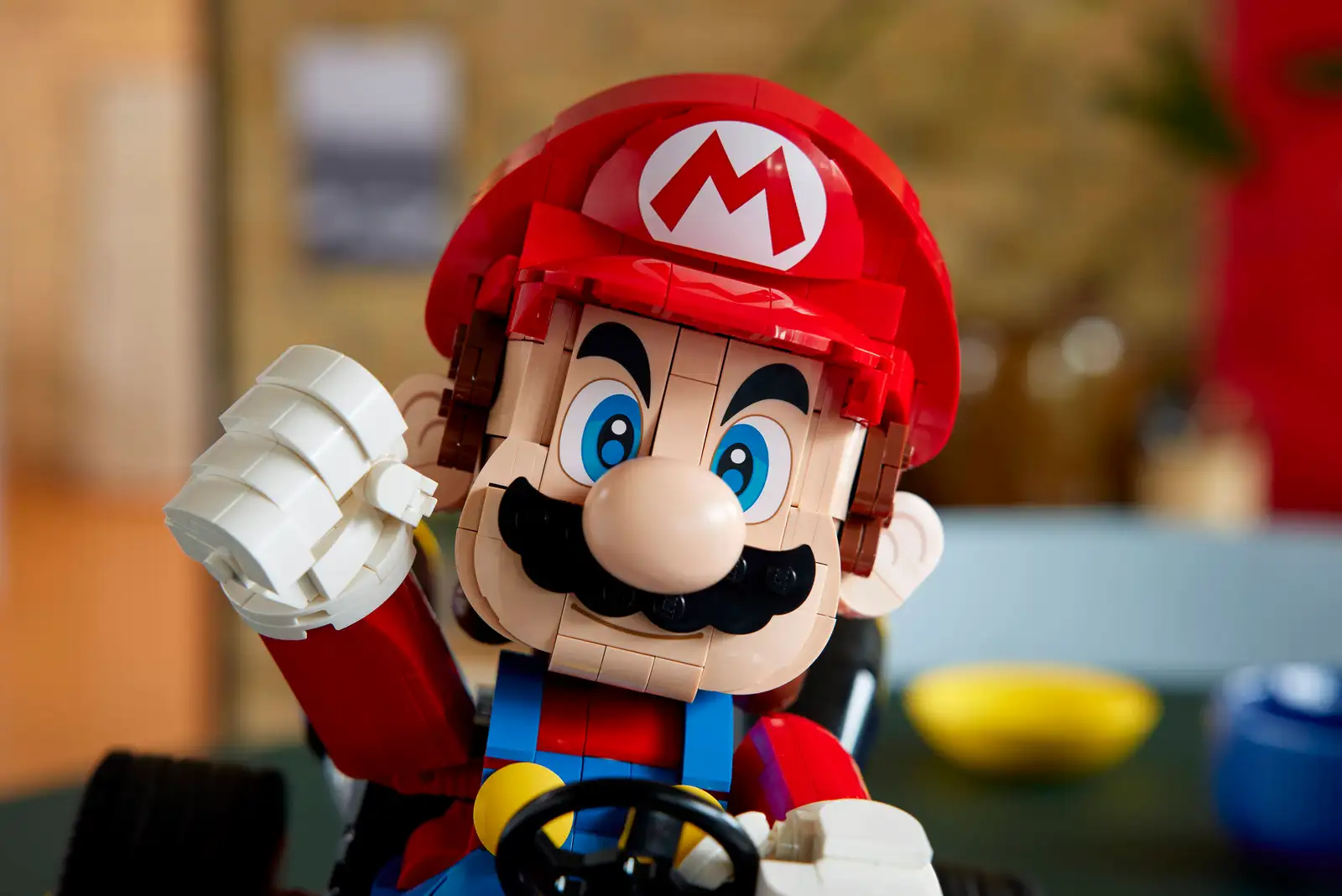 Close up of LEGO Mario in his kart.
