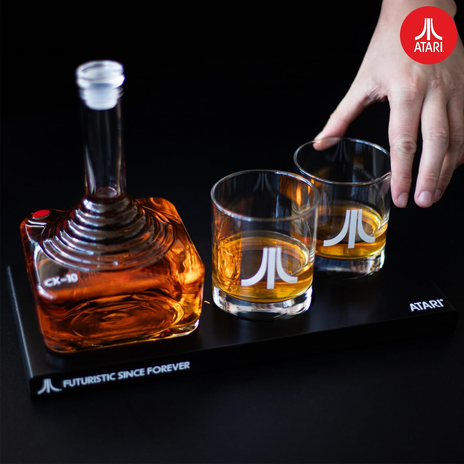 Atari Decanter set with glasses on a back background