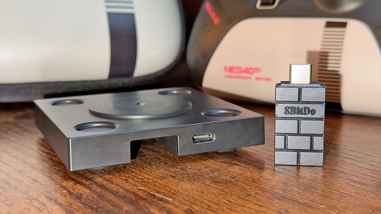 Side view of a charging dock and an 8BitDo USB dongle