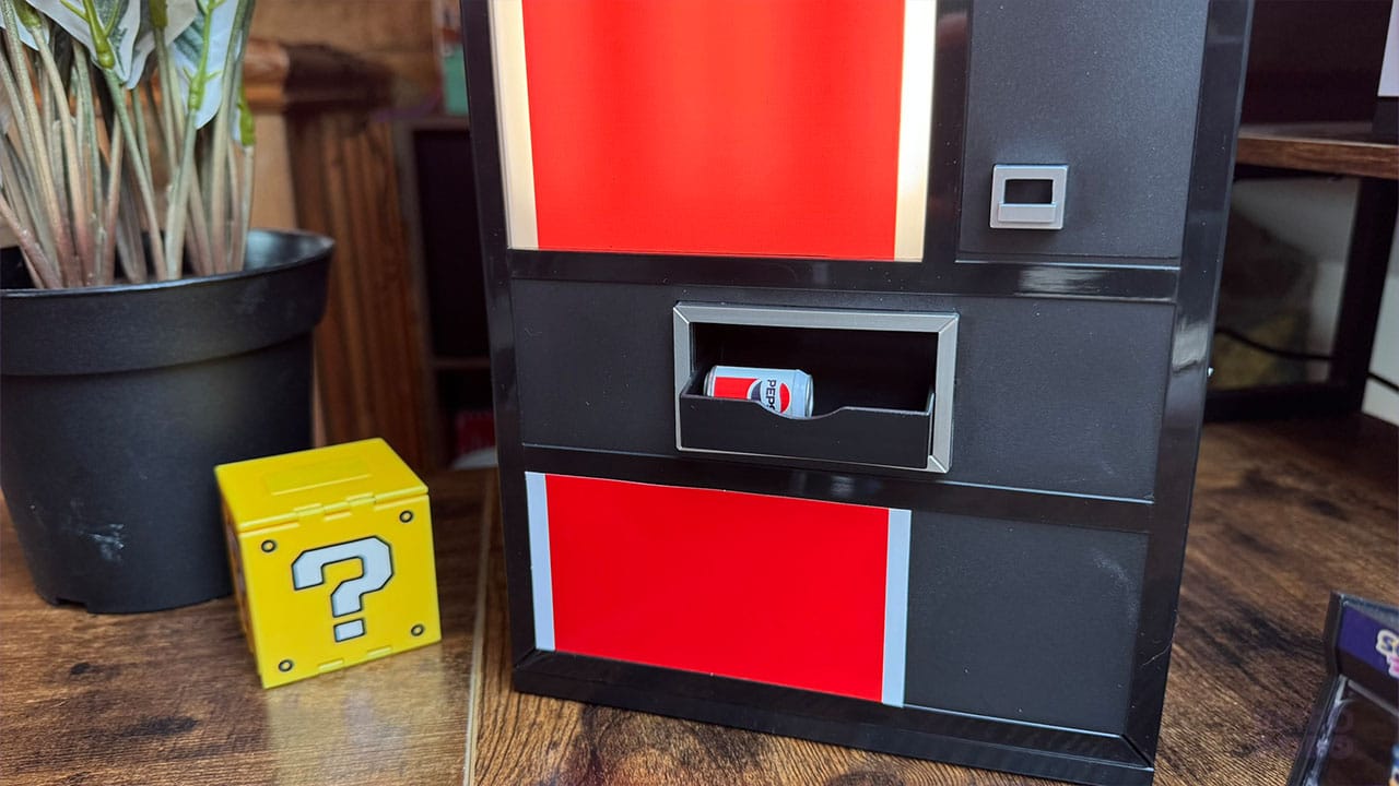 A miniature Pepsi can in the drinks collection tray on the vending machine USB hub