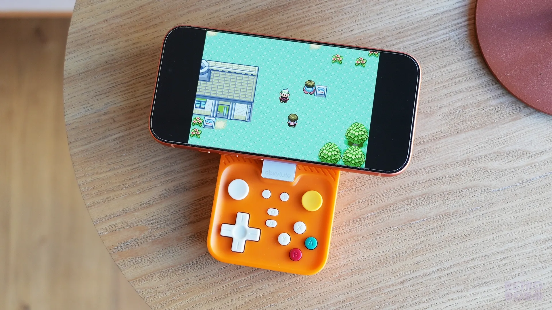 Pokemon on Brandon's iPhone, connected up to an orange mobile controller