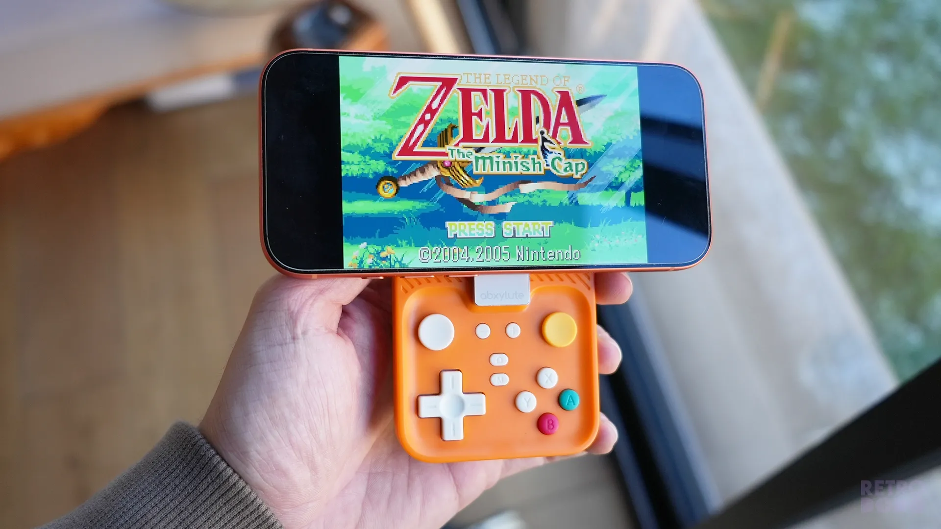 Zelda Minish Cap on Brandon's iPhone, attached to a mobile controller