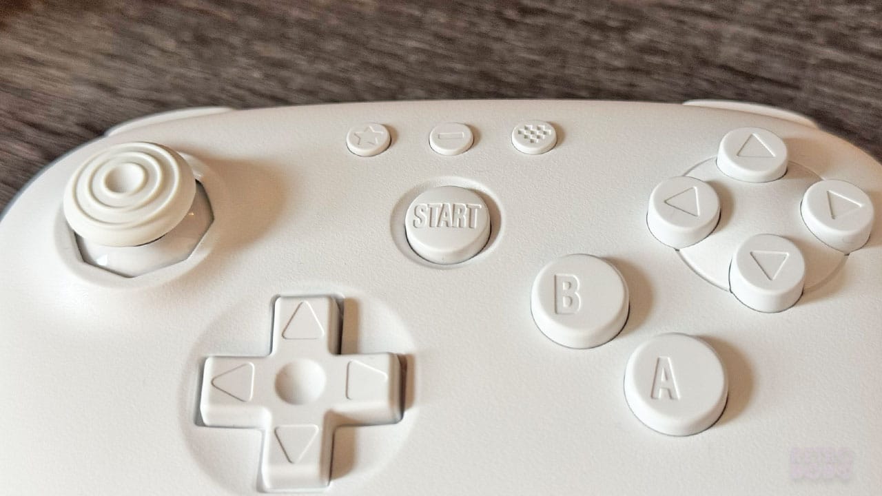 Close up of the Start and D-pad buttons on the 8BitDo 64 Controller