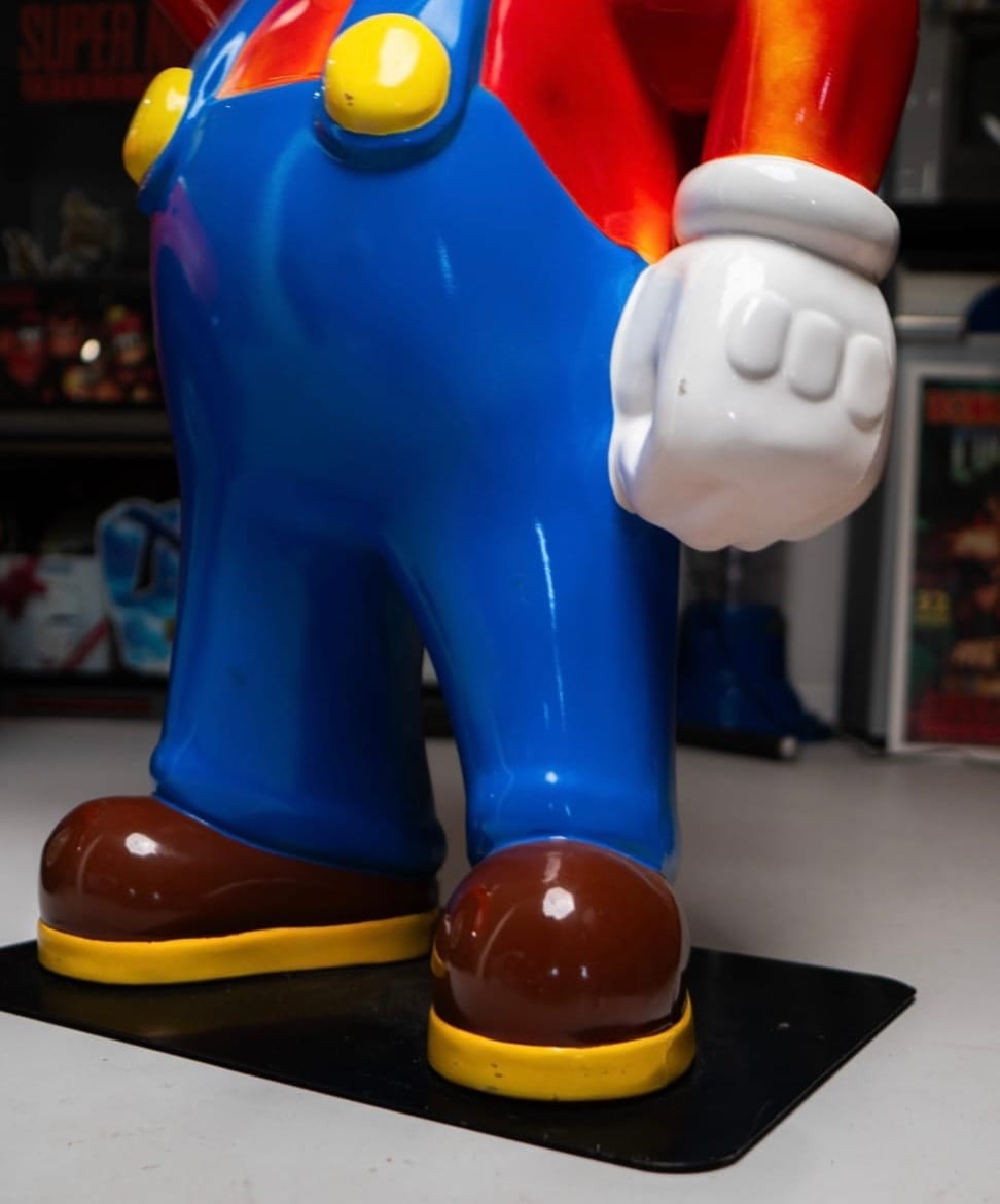 Shoes and dungarees on the Mario promo statue