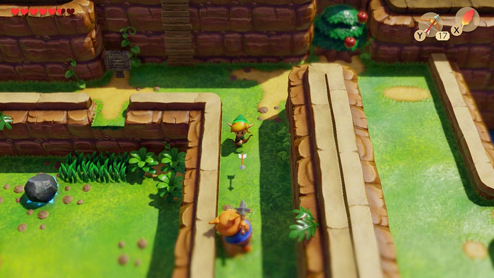 Sample gameplay shot of The Legend of Zelda Link's Awakening showing Link firing an arrow at a Moblin