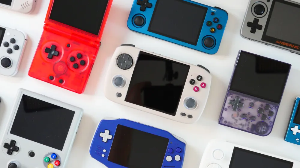 A selection of Anbernic handhelds on a white background