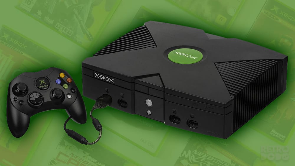 An Original Xbox sitting over the top of our Xbox game collection