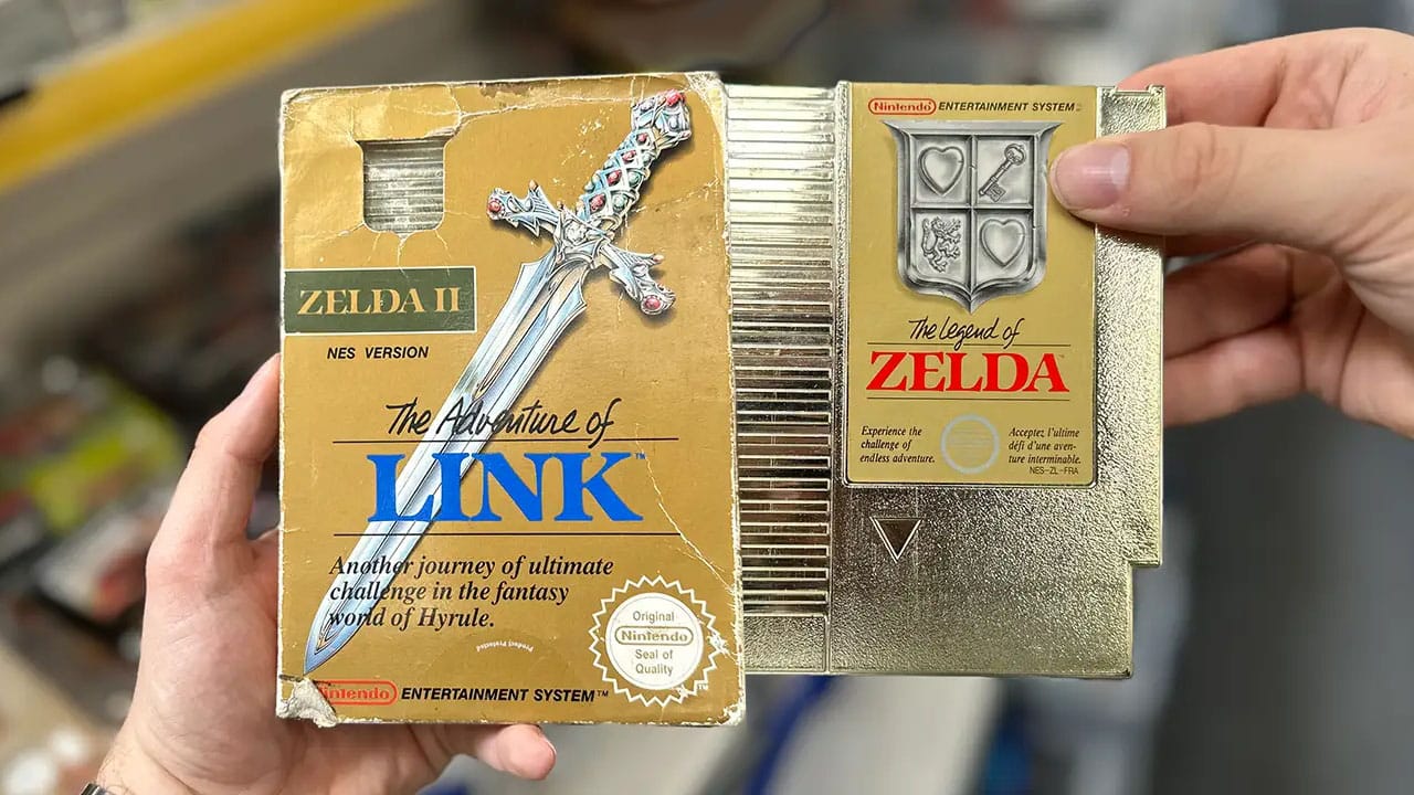 two tough Zelda games held by Retro Dodo team members