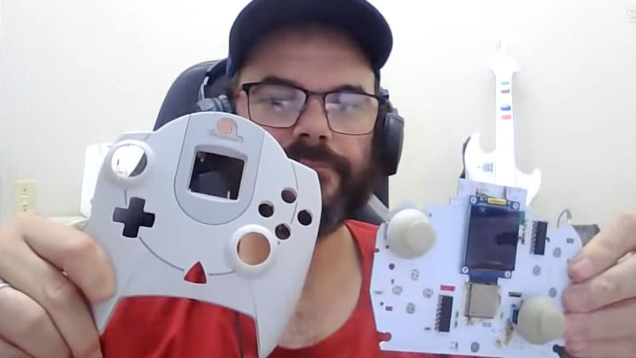 Angelo holding a shell and PCB that accommodates two analog sticks