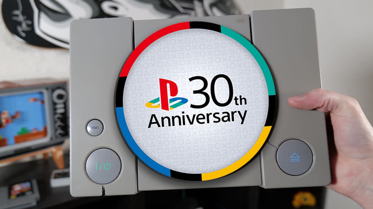 Playstaion console held by Rob with the 30th anniversary logo