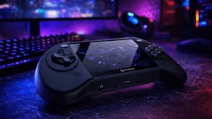 Hyperkin Mega95 handheld on a desk with purple lighting behind it