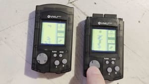 Two 8BitMods VMUPros with Tetris Multiplayer running