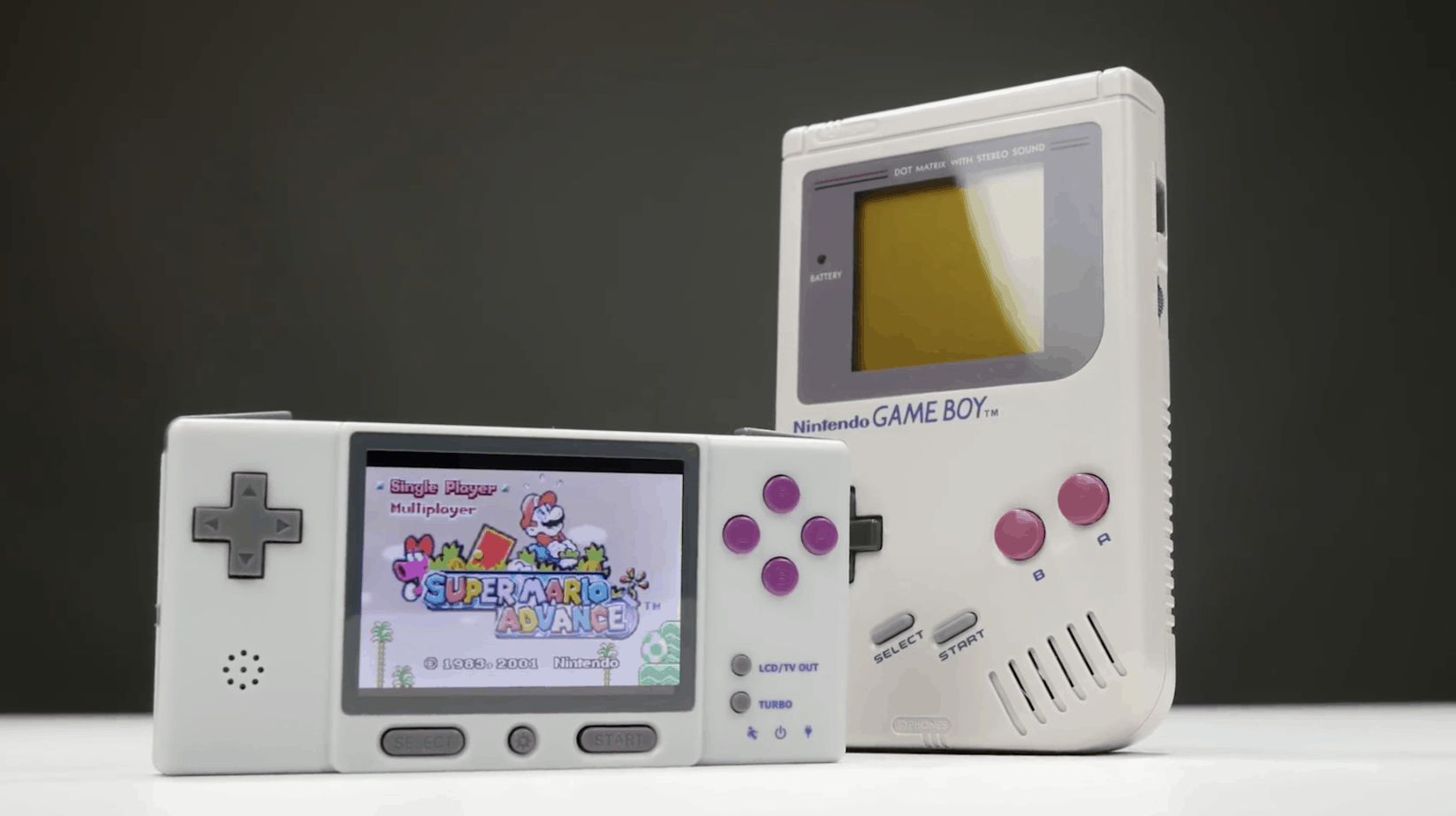 Digi Retroboy standing next to a grey Game Boy DMG