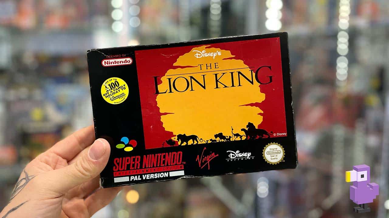 Seb holding a boxed copy of The Lion King for the SNES