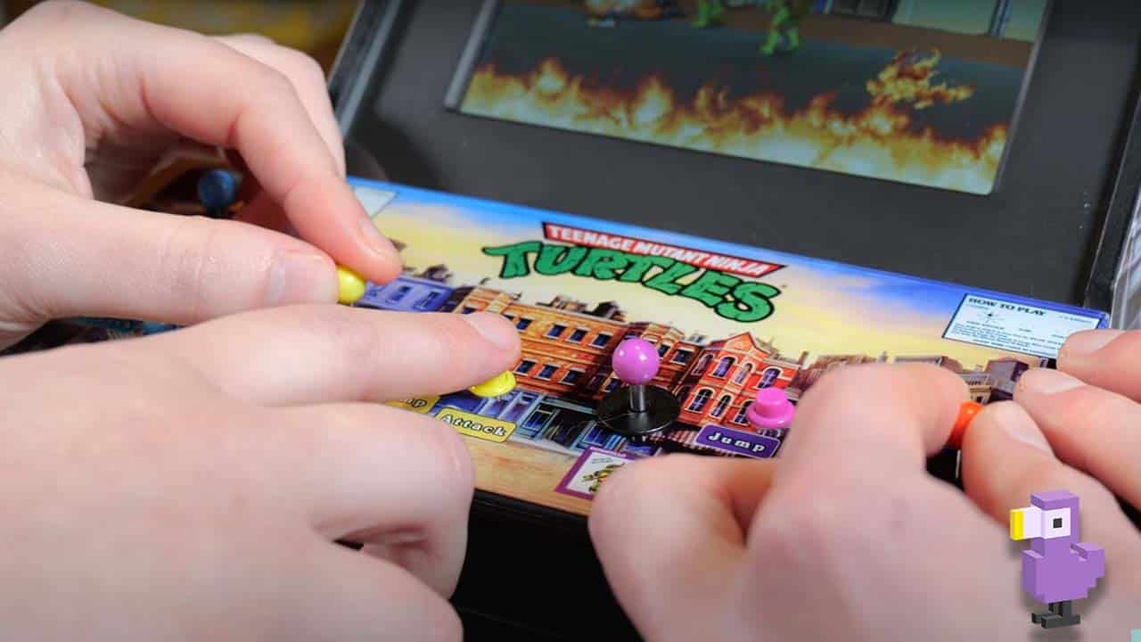 Two players struggling with the quarter arcade cabinet at once