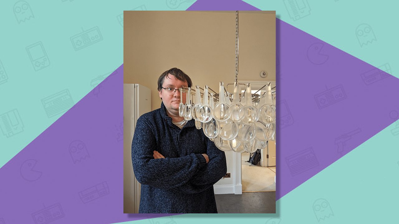 Samuel's podcast co-host, Matthew Castle, with the infamous magnifying glass chandelier. 