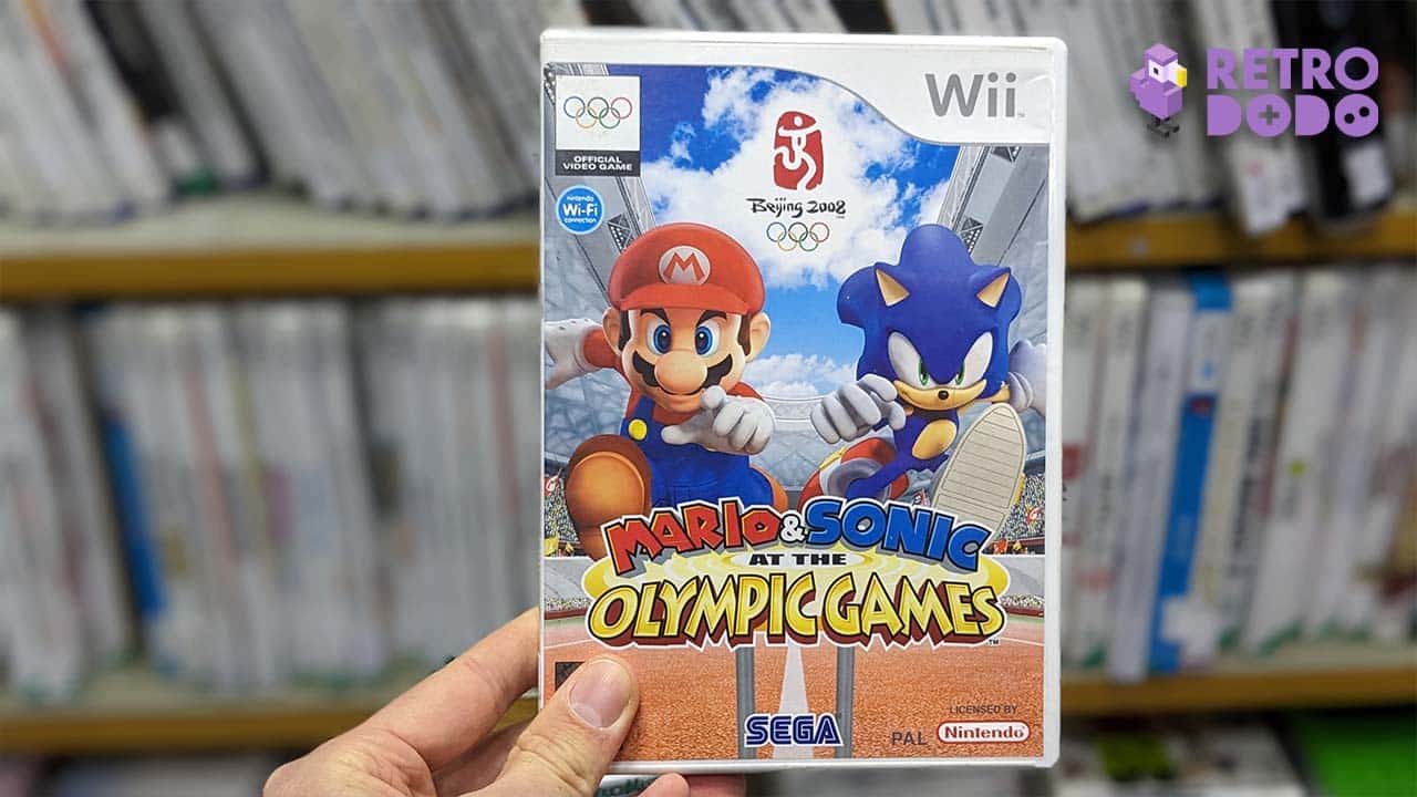 Theo holding Mario & Sonic at the Olympic Games for the Wii