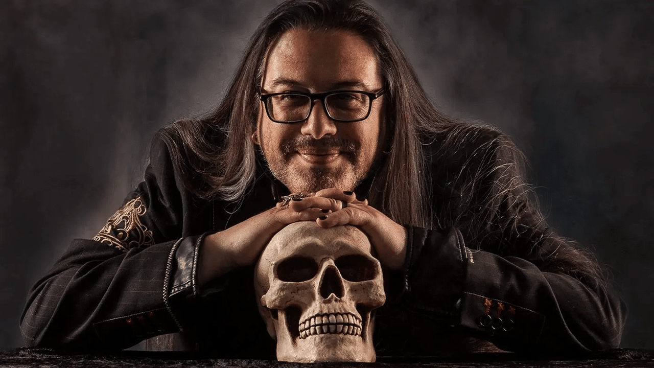 John Romero posing with a skull.