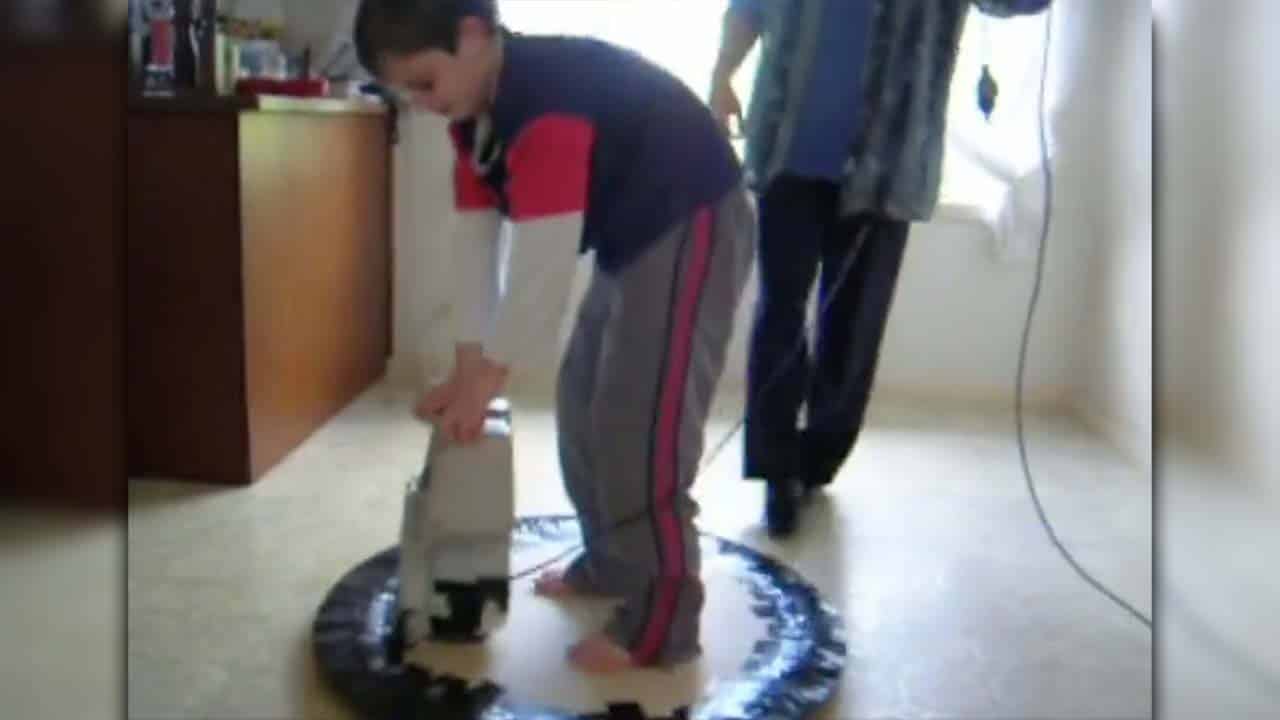 Tom's son on the hover vacuum