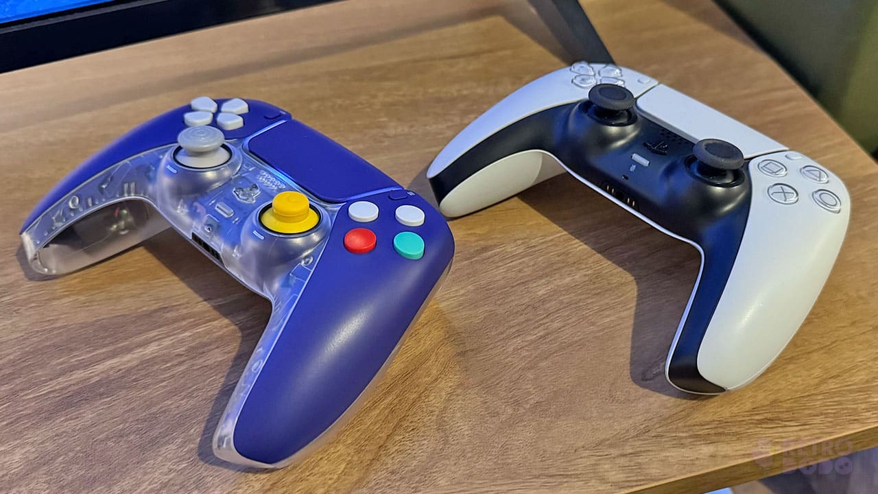 A PS5 DualSense controller (White) next to the indigo CubeSense controller