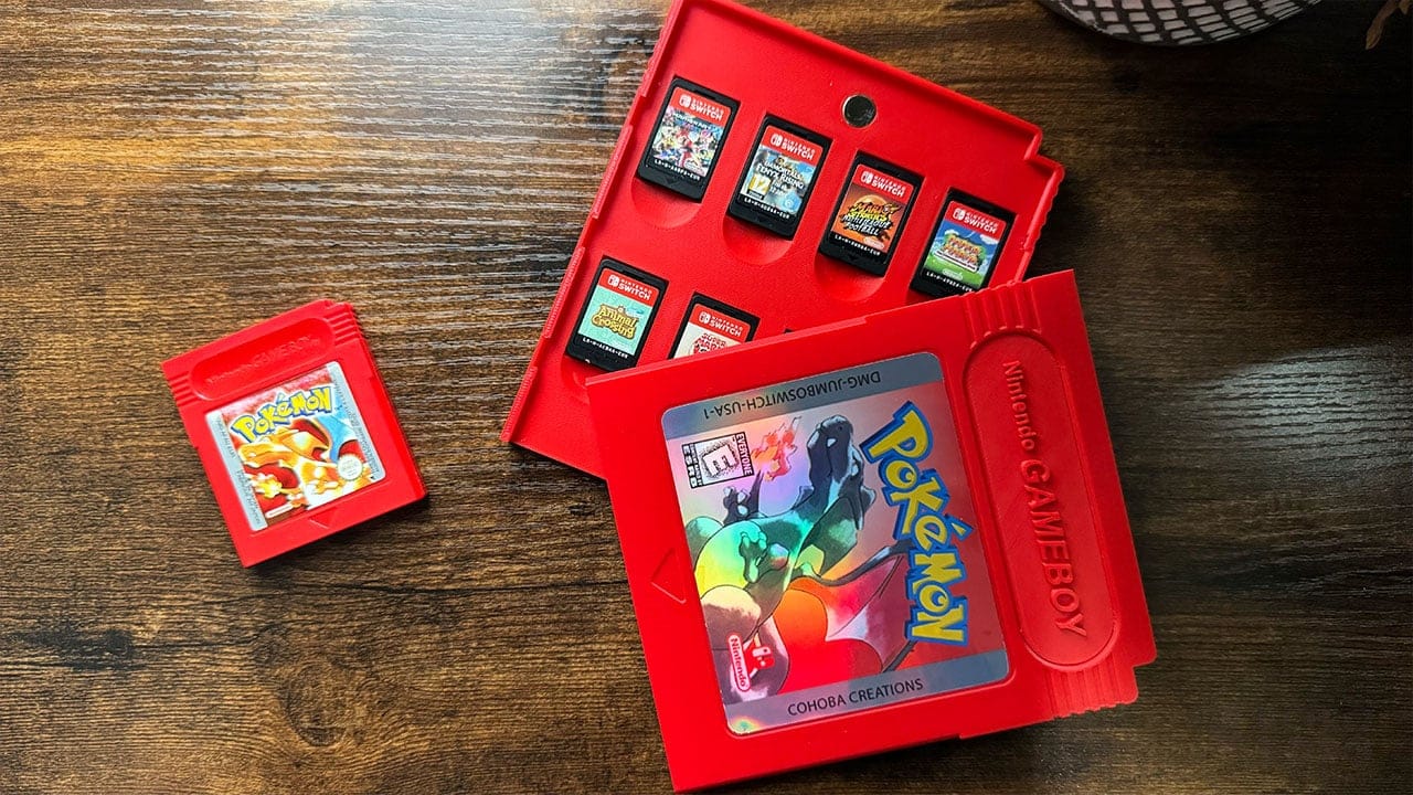 A jumbo game cartridge with the lid off showing Nintendo Switch games stored inside