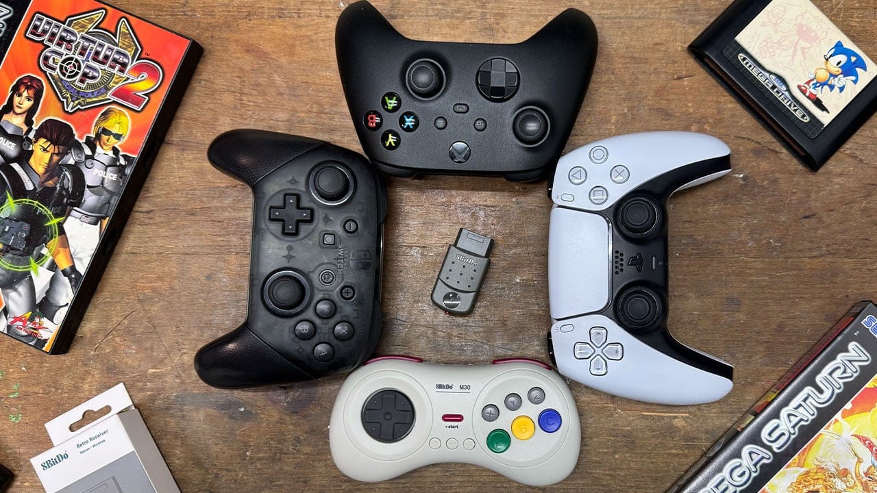 Four controllers with the Saturn receiver in the middle