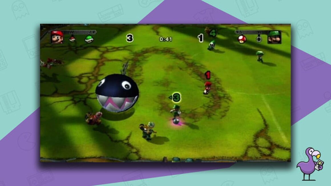Mario Strikers Charged gameplay, with players avoiding a chain chomp on the pitch, Luigi in possession of the ball.