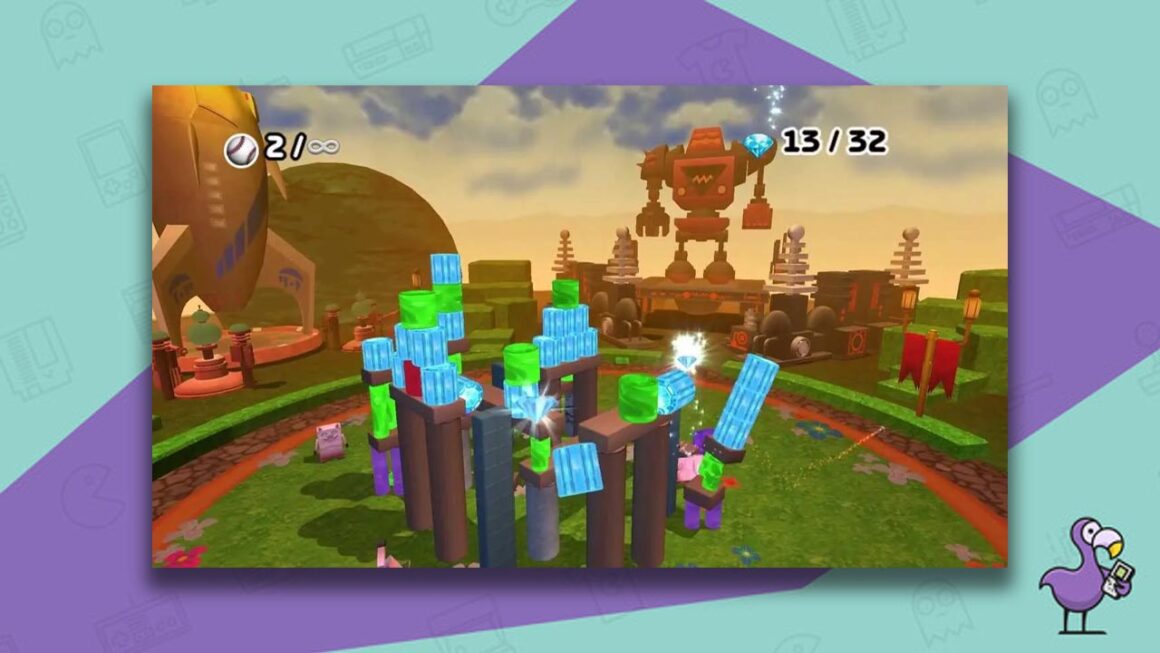 Boom Blox gameplay showing a robot standing in the distance while blocks fall off towers