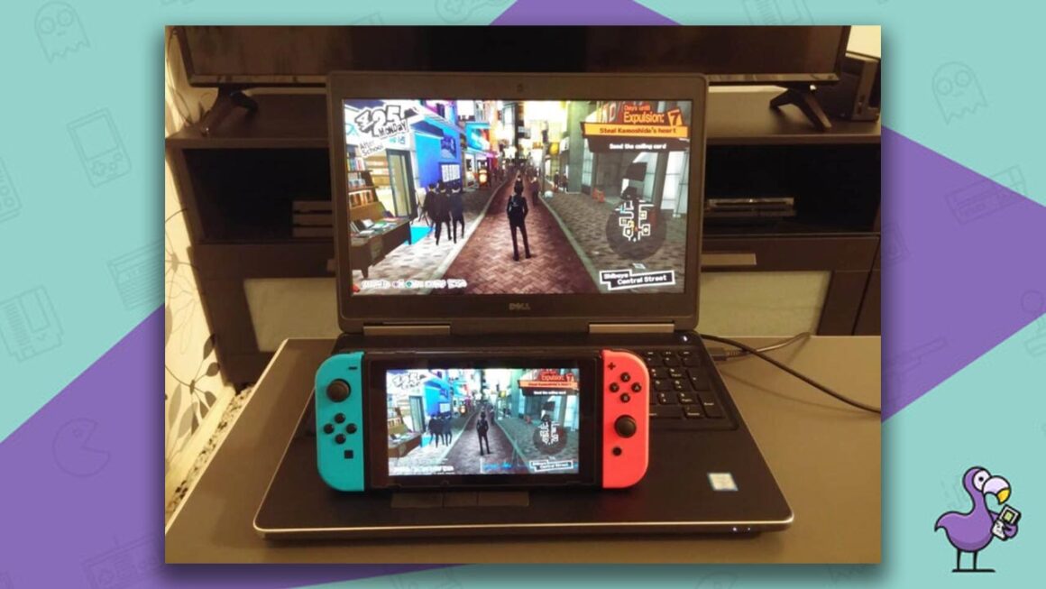 A Nintendo Switch resting on a laptop, both showing the same clip for the same game.