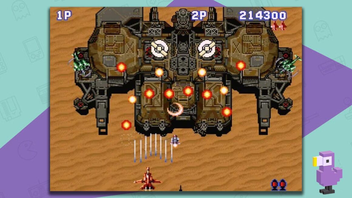 Aero Fighters gameplay showing a red craft flying towards a large ship while firing missiles