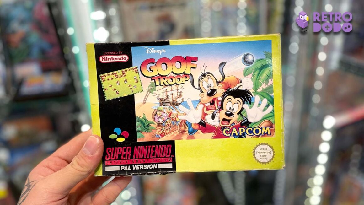 Seb holding a boxed copy of Goof Troop for the Super Nintendo Entertainment System