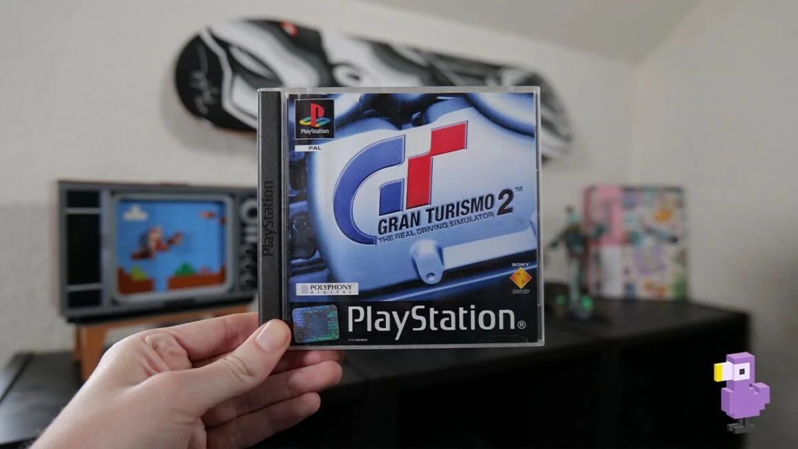 Gran Turismo 2 game case for the PS1 in Rob's hand