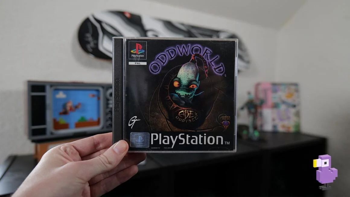 Rob holding his copy of Oddworld: Abe's Oddysee for the PS1