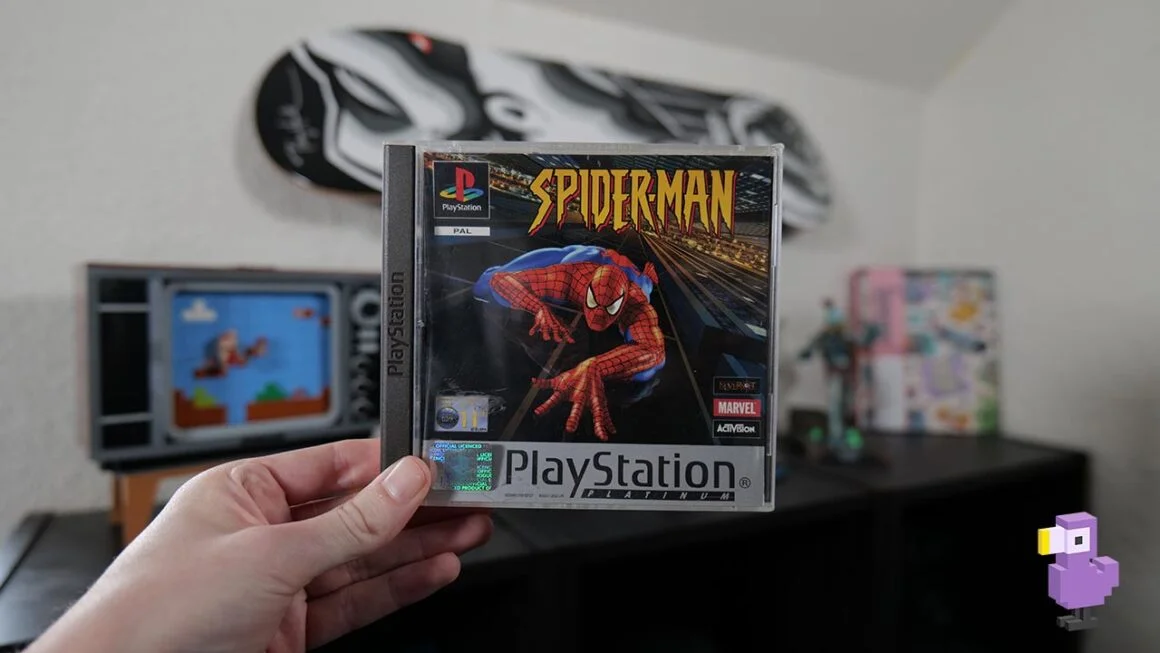 Spider-Man game case held by Rob in his studio