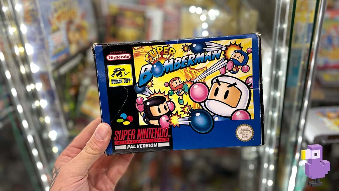 Super Bomberman Game box held by Seb