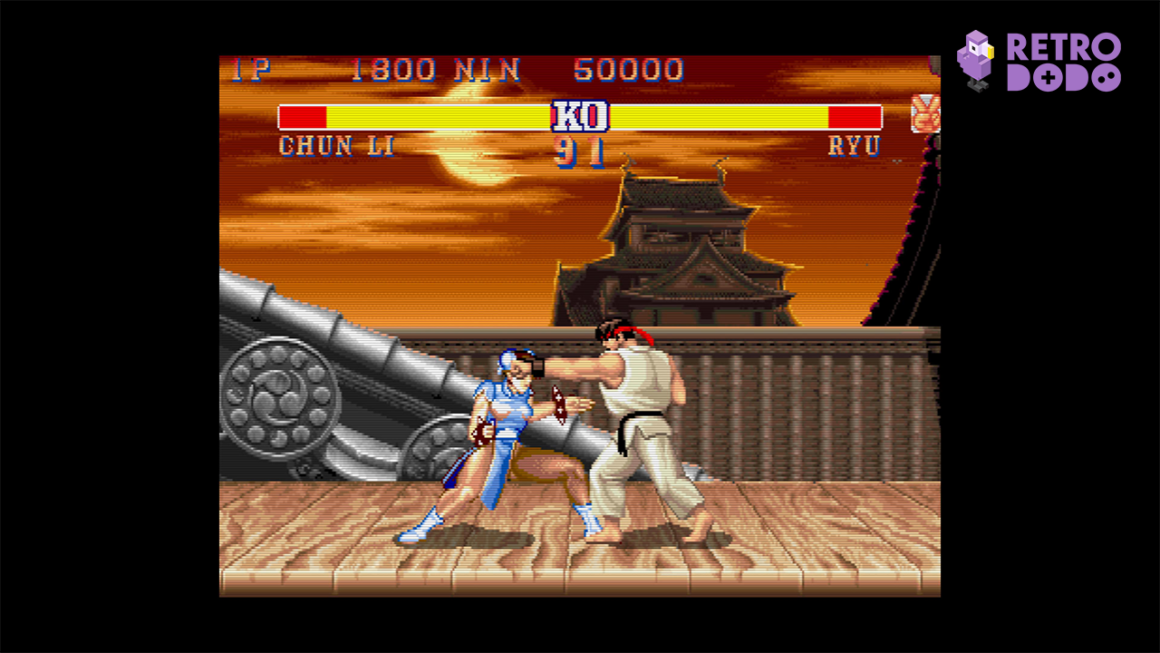 Chun-Li takes a punch from Ryu
