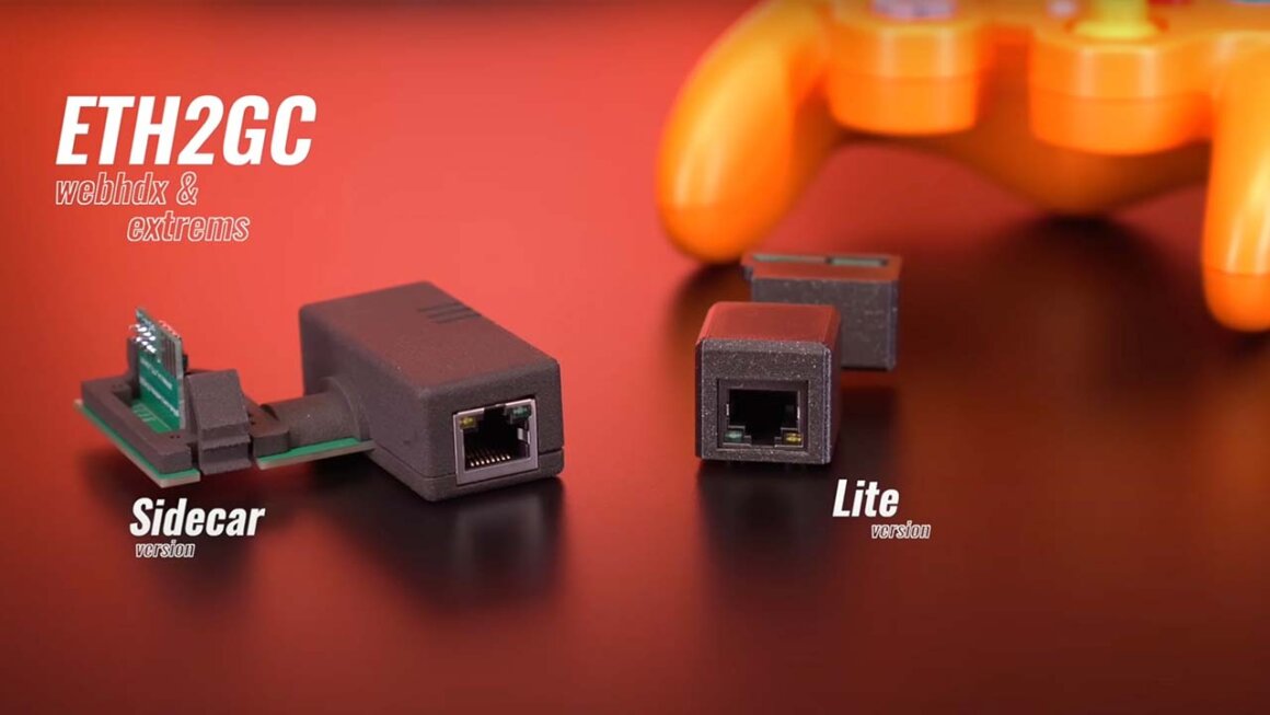 Both versions of the ETH2GC adapter on a table next to an orange GameCube controller
