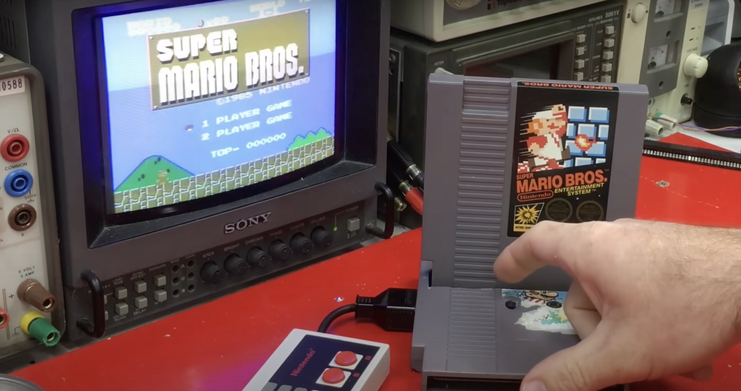 A NES Cartridge playing another game after being turned into a console through modding