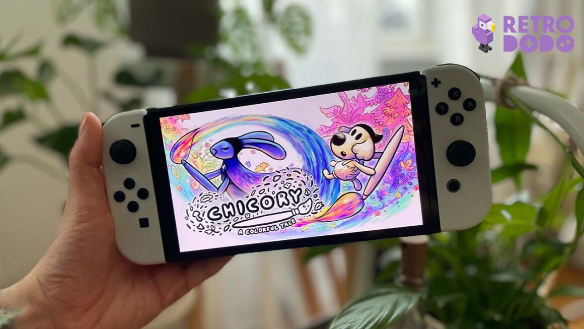 A white Nintendo Switch showing game art for Chicory A Colorful Tale