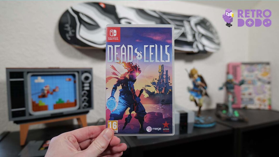 Dead Cells game case for the Switch held by Rob in his studio